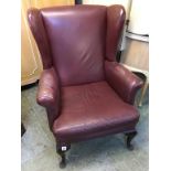 A burgundy Wing armchair. Provenance: Used in the Alan Bennett film 'Dinner at Noon'