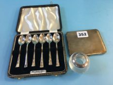 Cased set of silver teaspoons and a silver cigarette case. Weight 5.5oz/172 grams and a silver match
