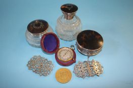 A travelling Harrods pocket barometer, three silver mounted and tortoiseshell dressing table