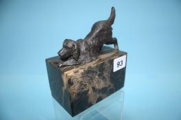 A dog on a marble base