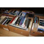 Five boxes of hard back books, both fictional and reference