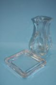 A Baccarat square shaped tapering vase and a Tiffany and Co. clear glass ashtray (2)