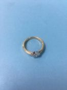 A diamond mounted ring, stamped 18K, size M/N, 3.4g