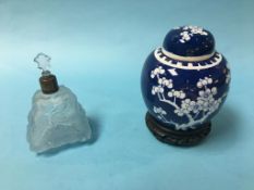 A Chinese blue and white ginger jar and cover and a triangular blue glass scent bottle