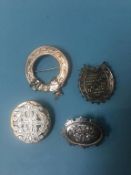 Four silver and other brooches