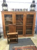 An early 20th century pine three door glazed school cabinet, with three fitted shelves, 185cm