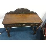 A oak side table with carved single drawer, 107cm wide