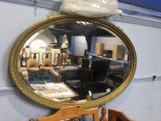 Gilt oval mirror, 96cm wide