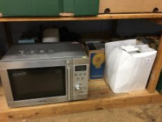 Shelf of assorted including a microwave