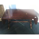 A reproduction mahogany Strongbow coffee table