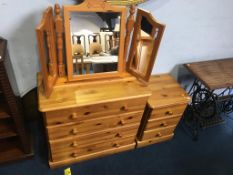 Two pine chest of drawers and a mirror