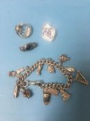 Silver charm bracelet etc.