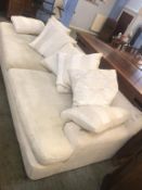 A large four seater cream settee (all covers removable and washable)