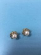 Pair of 18ct pearl mounted earrings