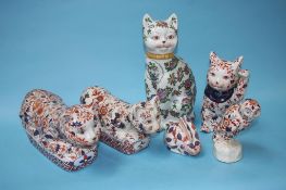 Four model cats, an owl and a rabbit
