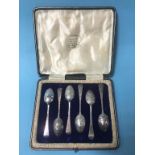 Cased set of six silver spoons, decorated with fox masks and riding crops