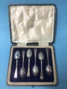 Cased set of six silver spoons, decorated with fox masks and riding crops