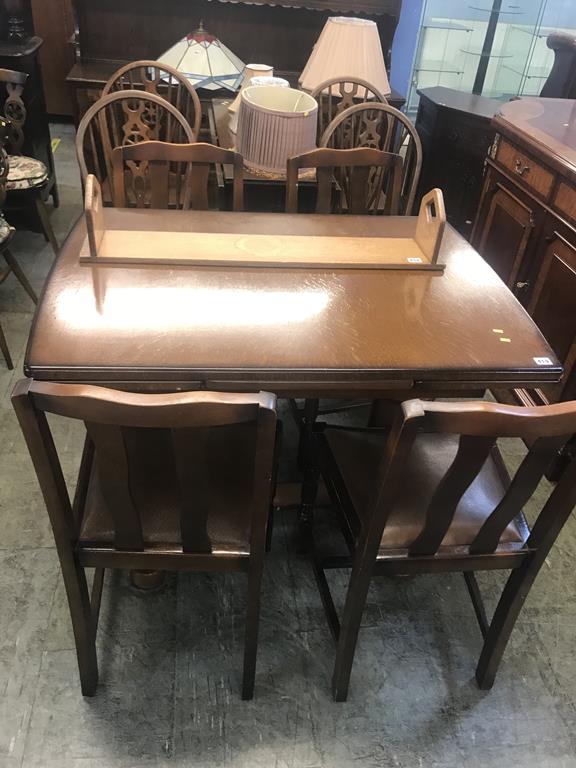 Oak drawer leaf table and four chairs