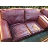 Two good quality leather purple settees, (one three seater and two seater) (2)
