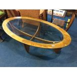 Teak oval and glass inset table