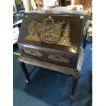 An Oriental carved bureau