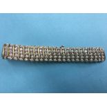 A tennis bracelet, stamped '375', 'DIA 300', 30.7g