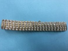 A tennis bracelet, stamped '375', 'DIA 300', 30.7g