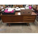 A small teak sideboard