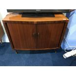 A walnut tambour front record cabinet