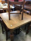 Oak drawer leaf table and four chairs