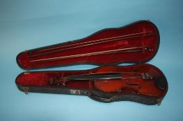 Copy of a Stradivarius violin, in fitted case, with two bows