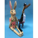 An articulated rabbit and a wooden pirate duck