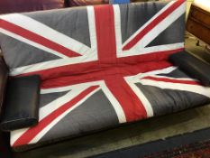 A large Union Jack upholstered bed settee