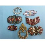 Seven enamelled and crystal buckles