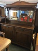 An oak mirror back sideboard