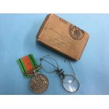 Un-named Defence medal with box and a pair of spectacles