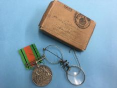 Un-named Defence medal with box and a pair of spectacles