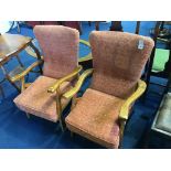 A pair of reclining armchairs