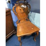 A Victorian oak hall chair