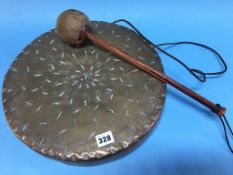 A brass dinner gong