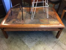 A large slate and oak coffee table