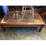 A large slate and oak coffee table