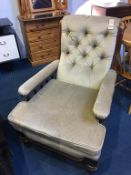 An Edwardian button back armchair