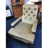 An Edwardian button back armchair