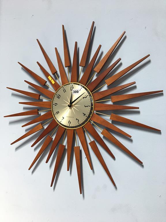 A Newgate sunburst wall clock