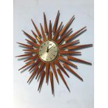 A Newgate sunburst wall clock