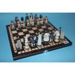 A chessboard and military figure chess pieces