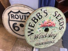 Two painted circular pine signs