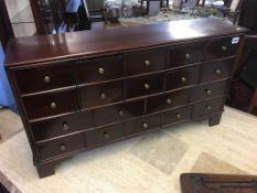 A set of 19th century mahogany herb drawers, having an arrangement of 19 drawers, 83cm wide, 22cm