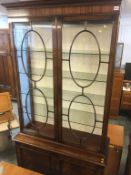 A reproduction mahogany display cabinet